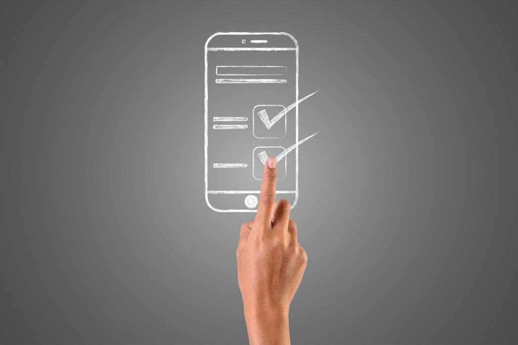 The hand that plays the smartphone is written with a white chalk